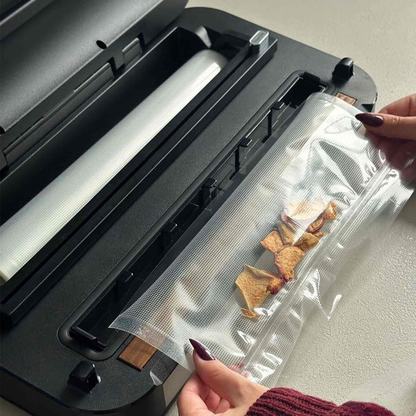 med hjälp av en vakuumförpackare